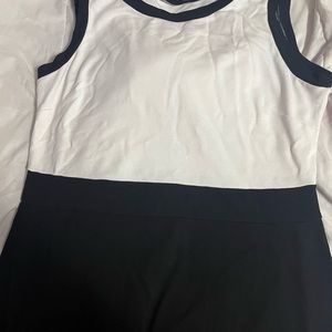 White top with a black bottom with a design built into the bottom